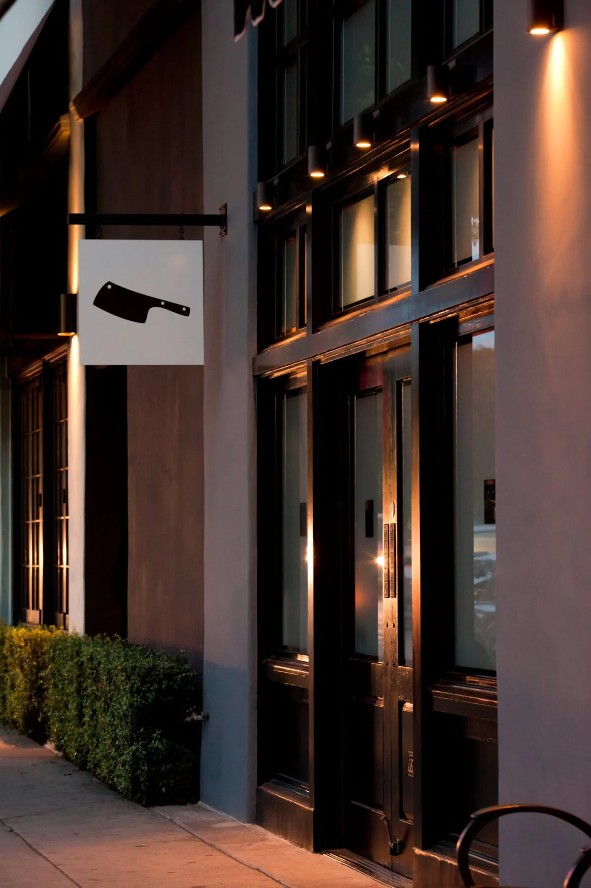 The evening exterior of Chi Spacca restaurant.