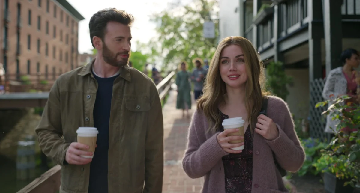 Chris Evans and Ana de Armas walk outdoors in a still from Ghosted.