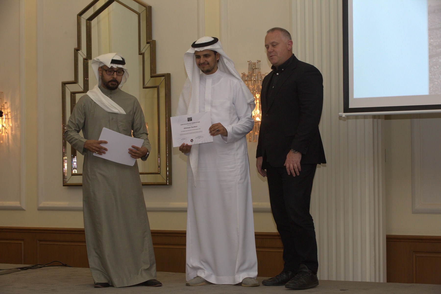 Othman Sunbul receiving a certificate after the NEOM-sponsored, ITP-delivered training program