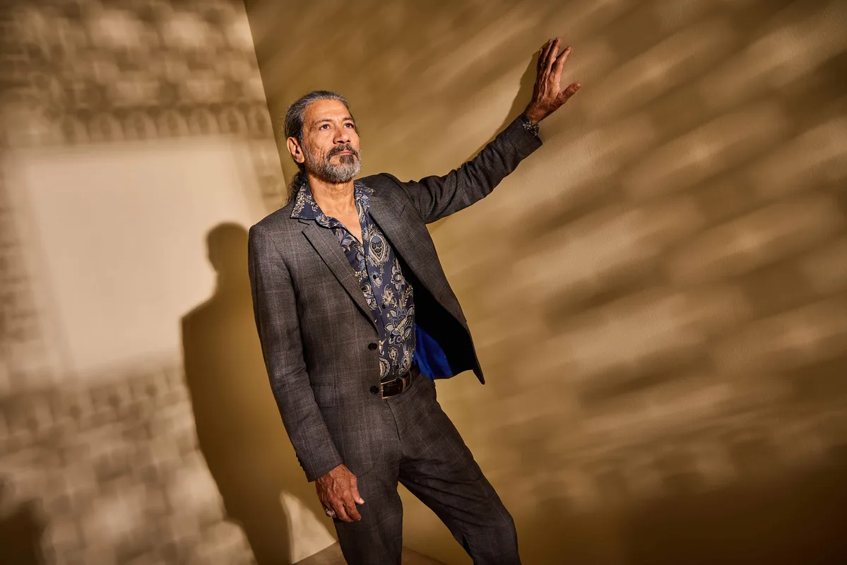 A guest photographed inside the Getty Images studio with patterned studio shadows.
