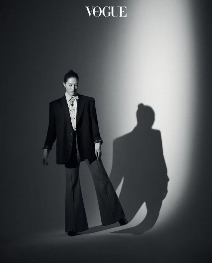 External art-direction reference showing patterned light across a fashion portrait; not festival-produced evidence.
