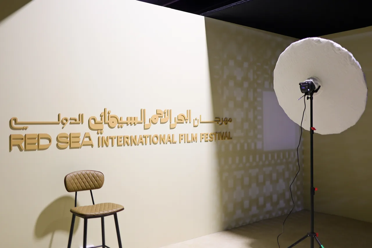 A prepared Getty Images portrait studio with a chair, studio light and Red Sea International Film Festival identity.