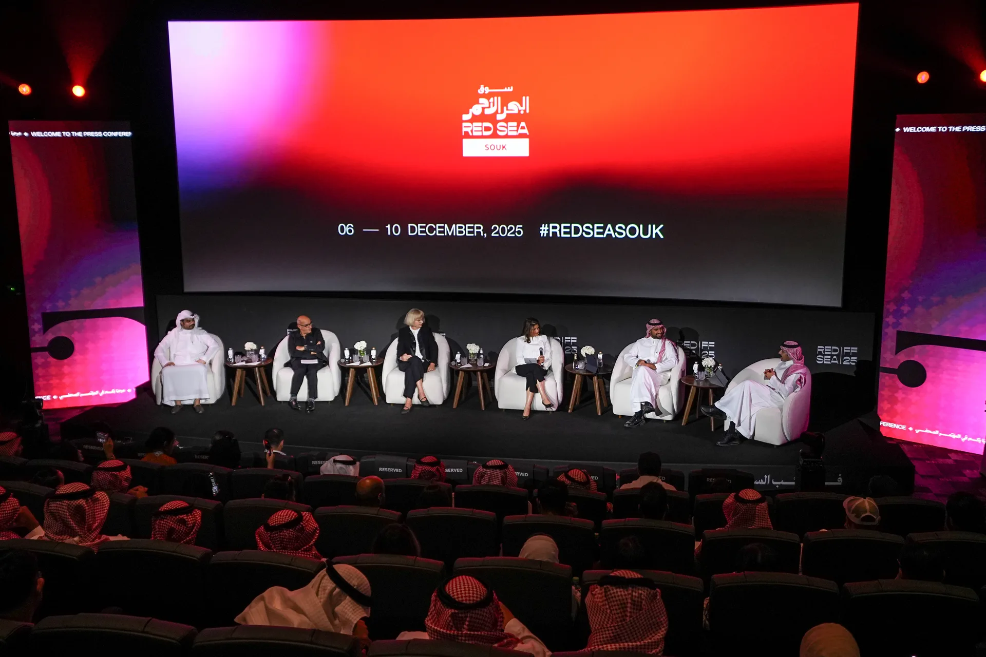 A Red Sea Souk press conference panel addresses an audience beneath the festival screen.