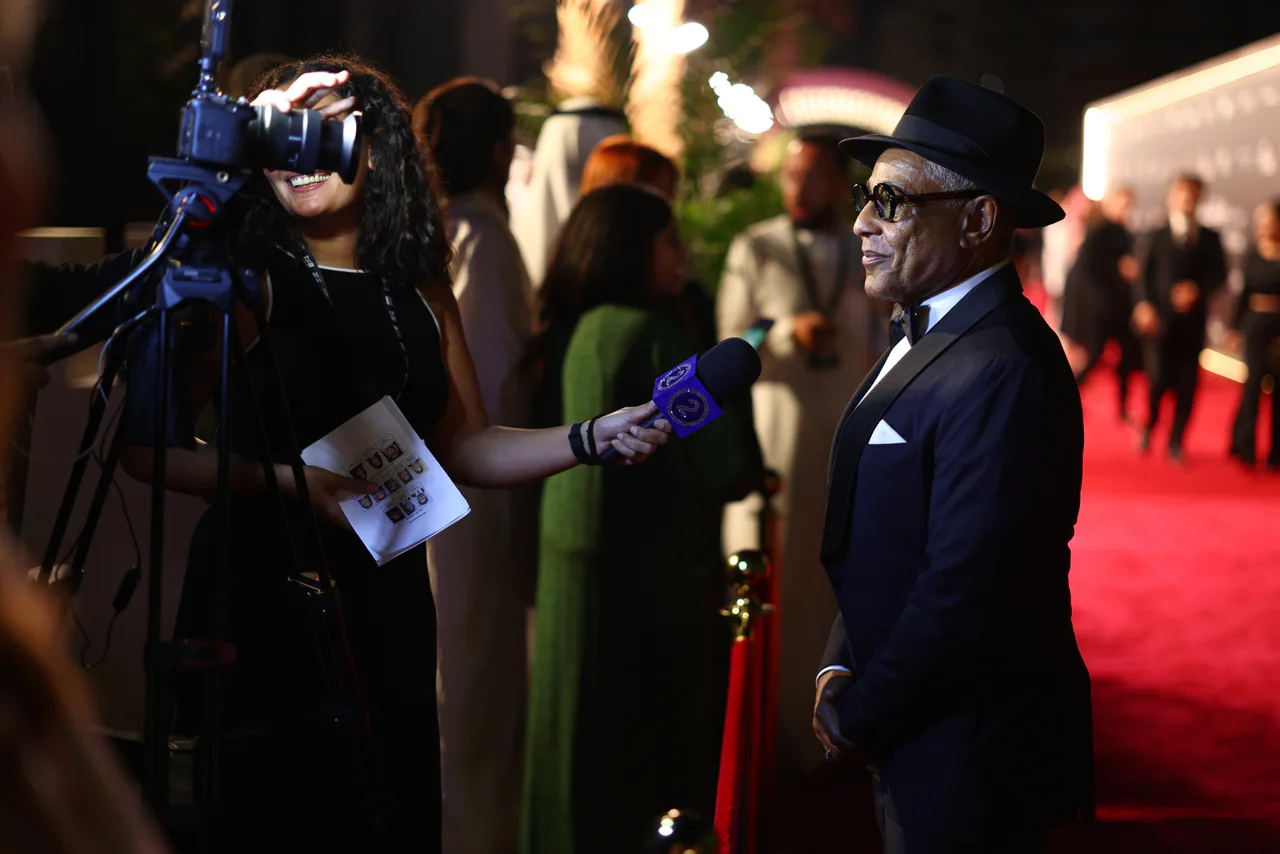 A Getty Images camera crew records an interview on the Red Sea Film Festival red carpet.